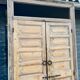 pair of old double-leaf doors with transom and carved frames