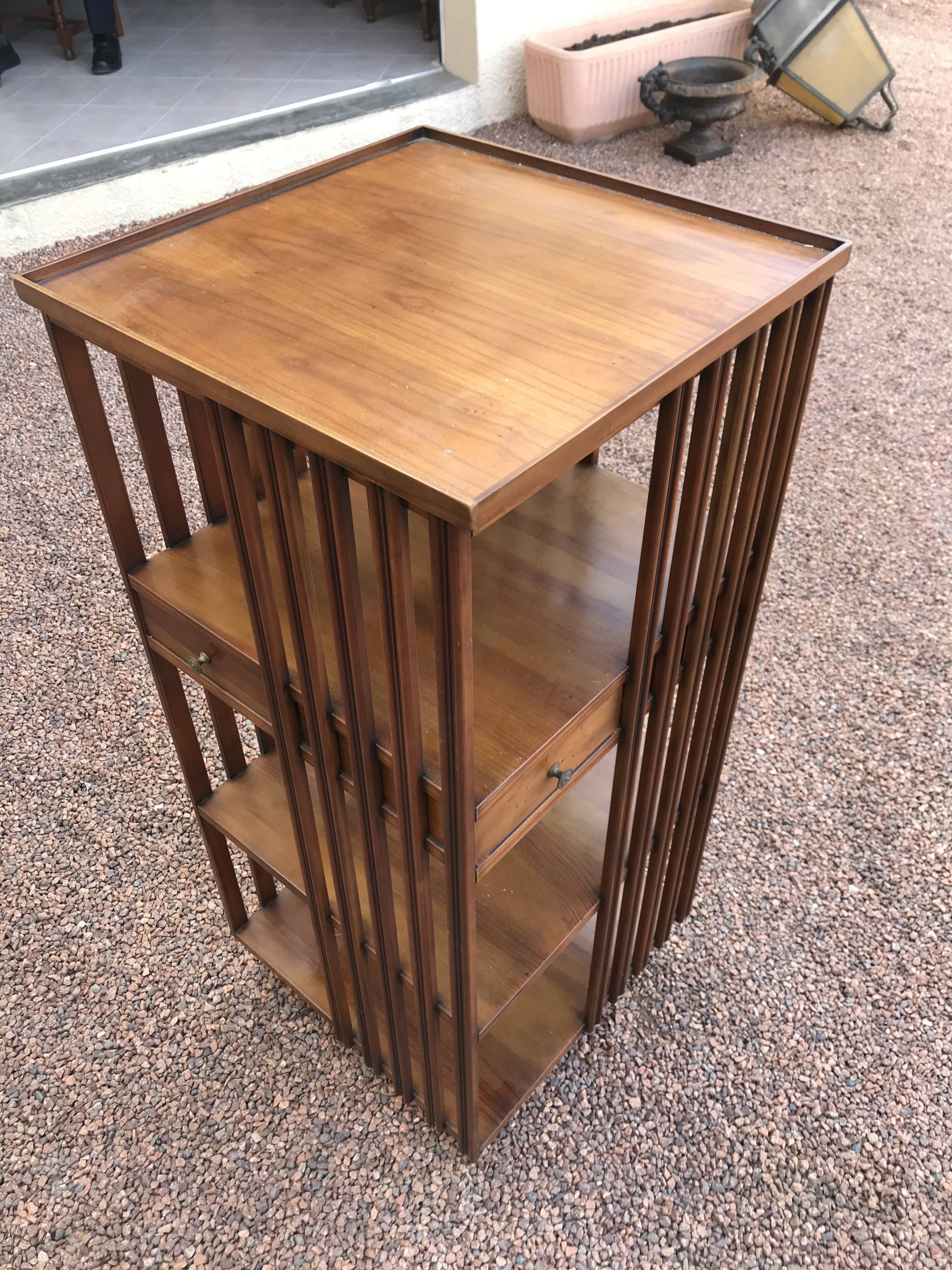 Revolving cherry bookcase