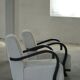 A pair of Swedish Art Deco lounge chairs with curved armrests, 1930s.