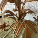 Golden vintage chandelier with leaf decoration