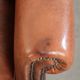 Comfortable vintage sheepskin armchair finished with decorative nails