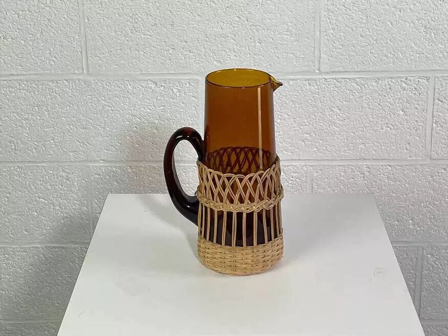 Vintage service for orangeade in amber glass and wicker.