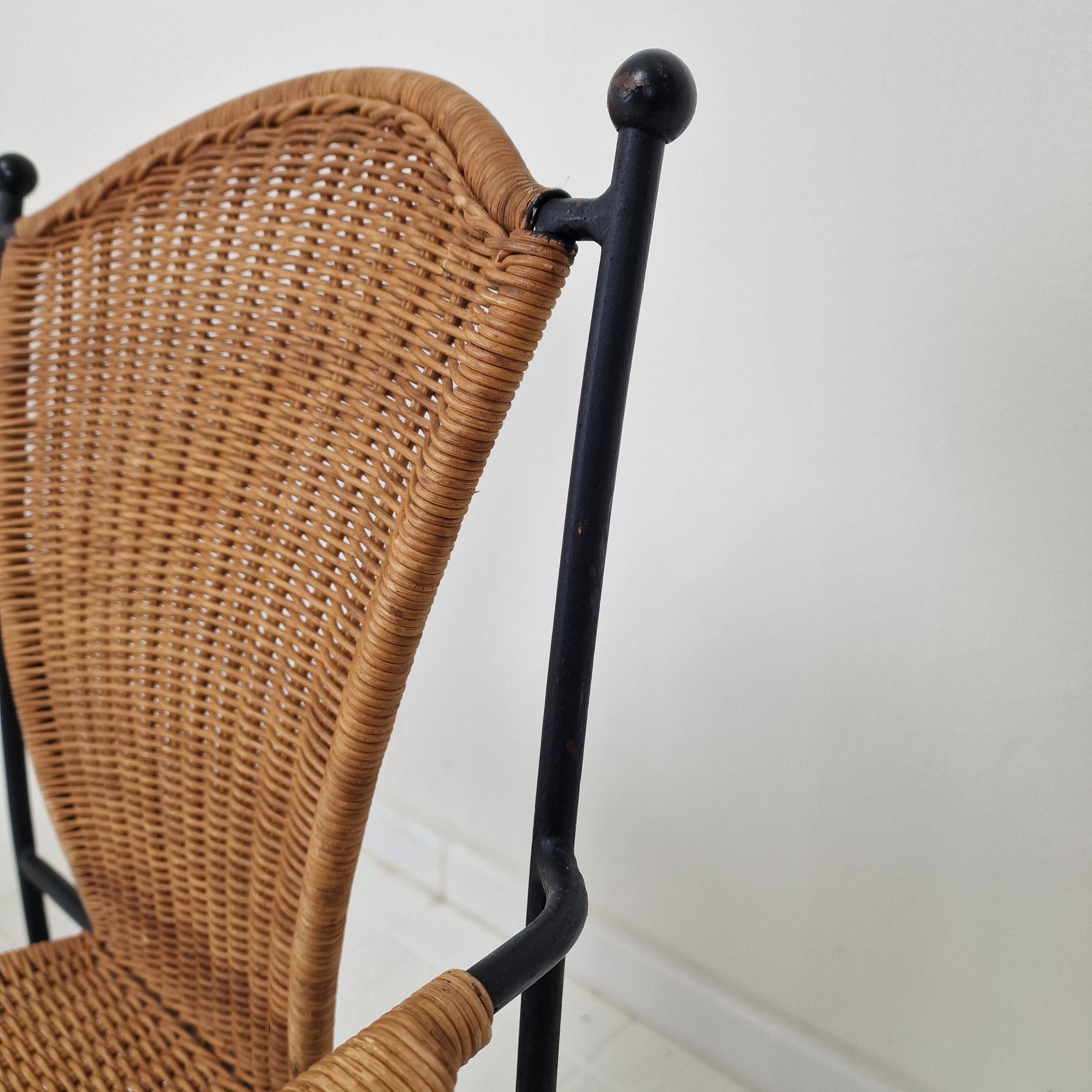 Pair of wicker and iron armchairs by Frederic Weinberg, United States, 1950s.