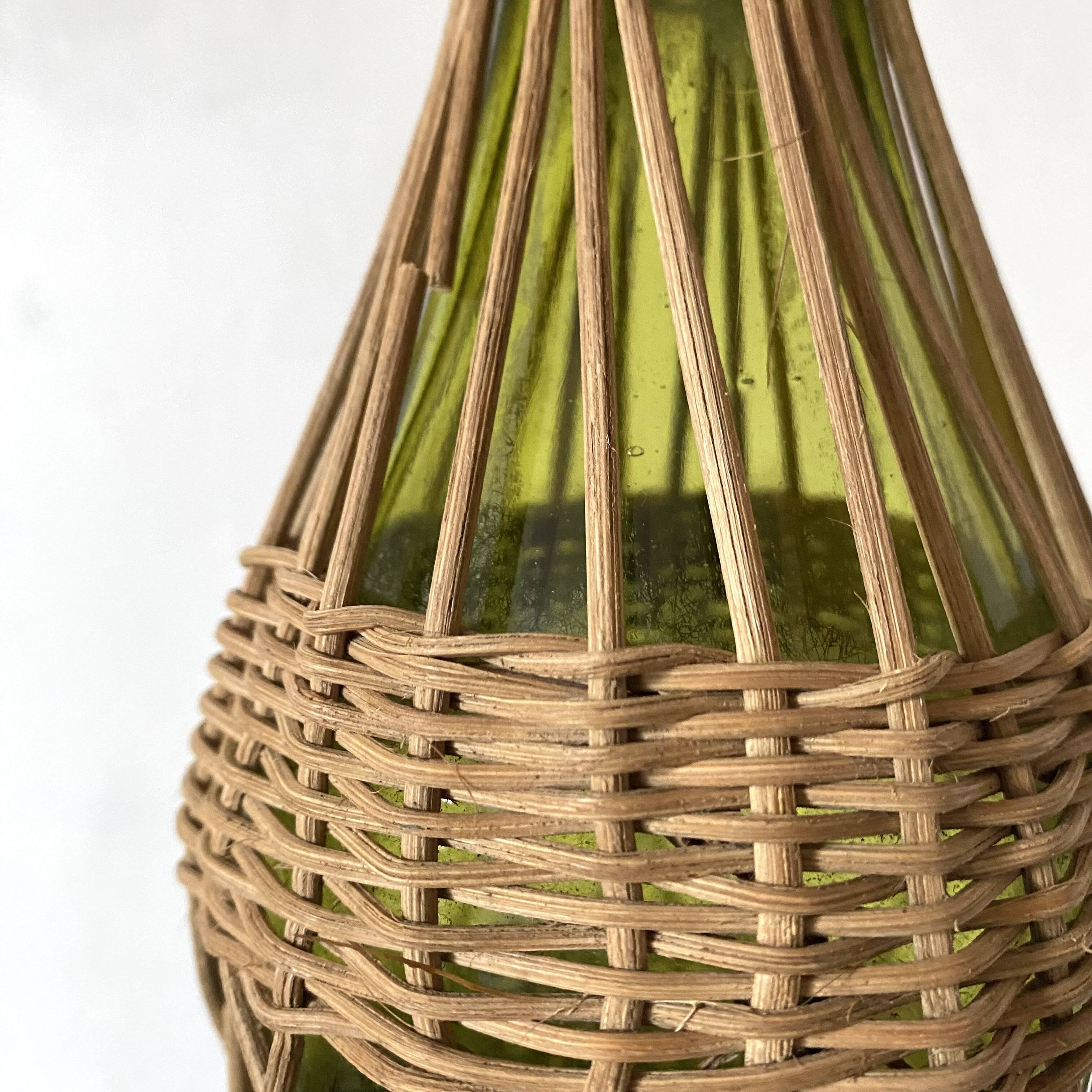 Glass bottles and woven rattan