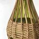 Glass bottles and woven rattan