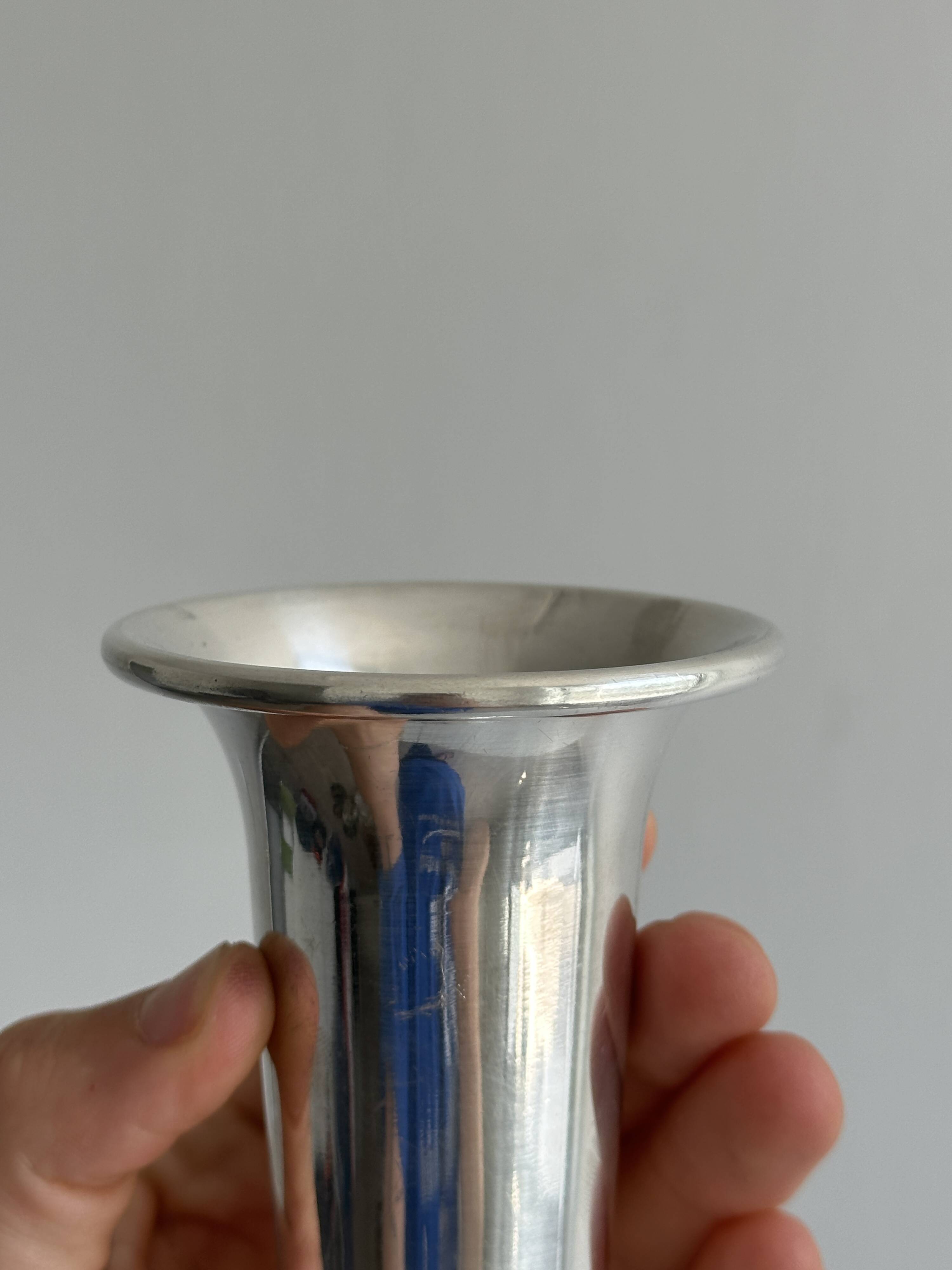 antique vase in shiny silver metal