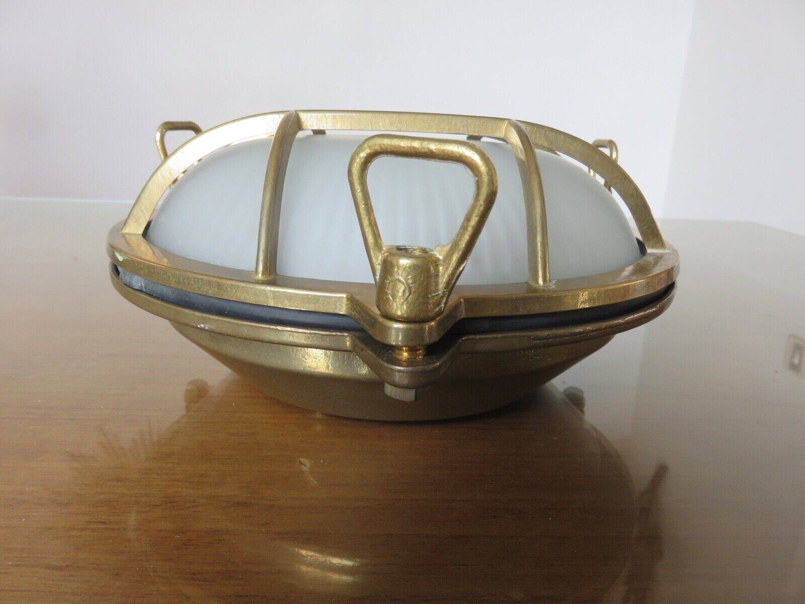 Brass porthole wall lamp