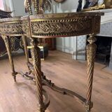 Console with 4 legs from the end of the 19th century in gilded wood in the Louis XVI style.
