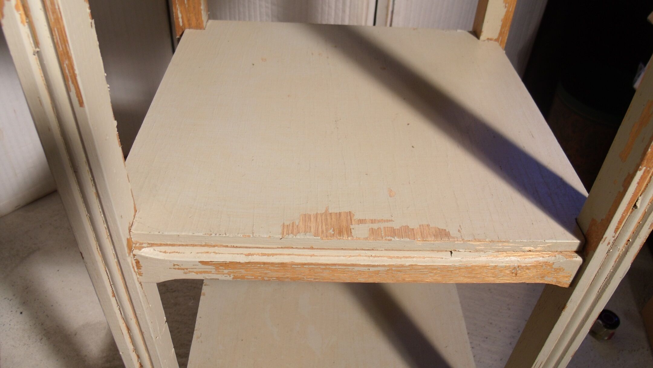 shabby wood side table on wheels