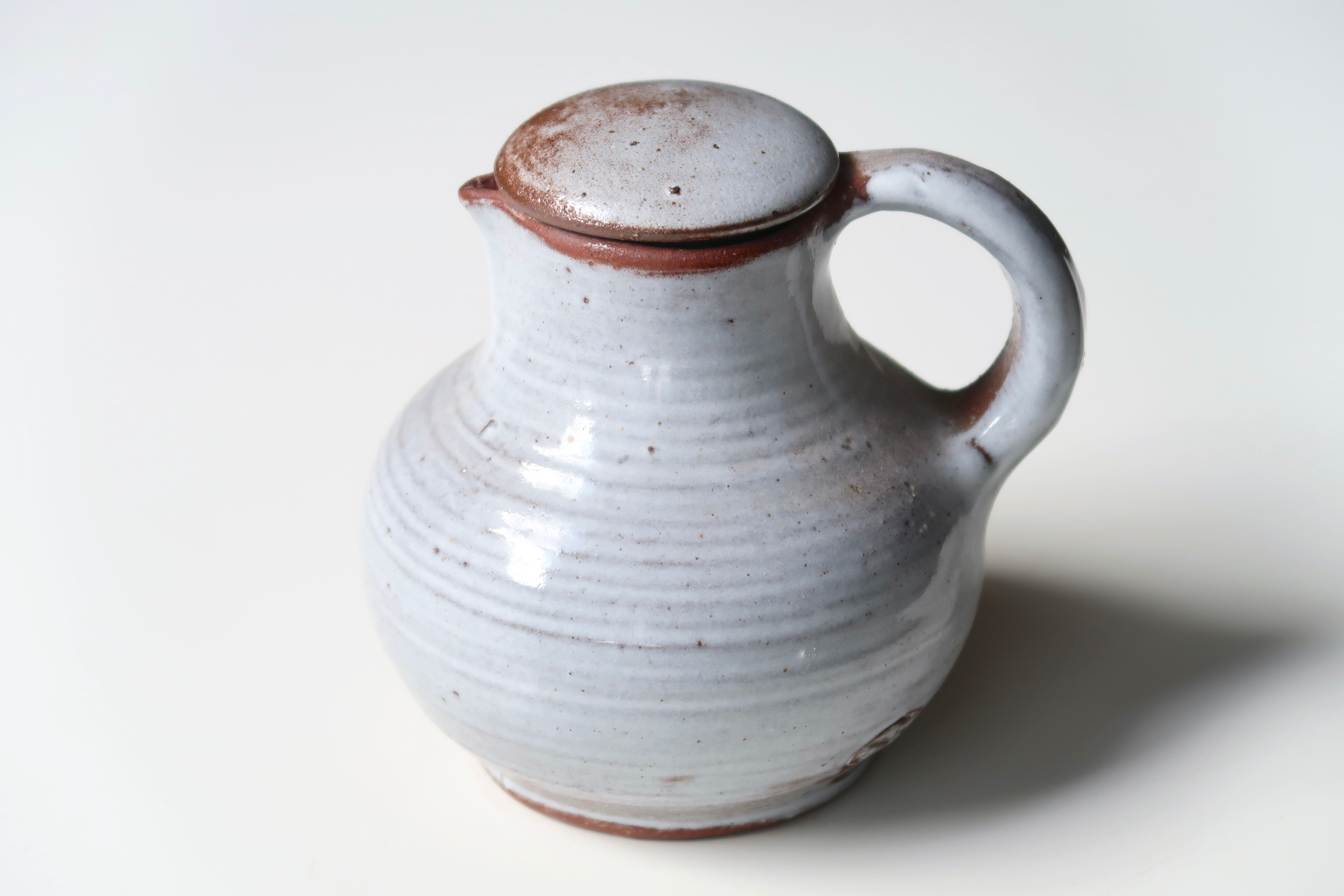 Sandstone milk pitcher by Jeanne and Norbert Pierlot, 60s