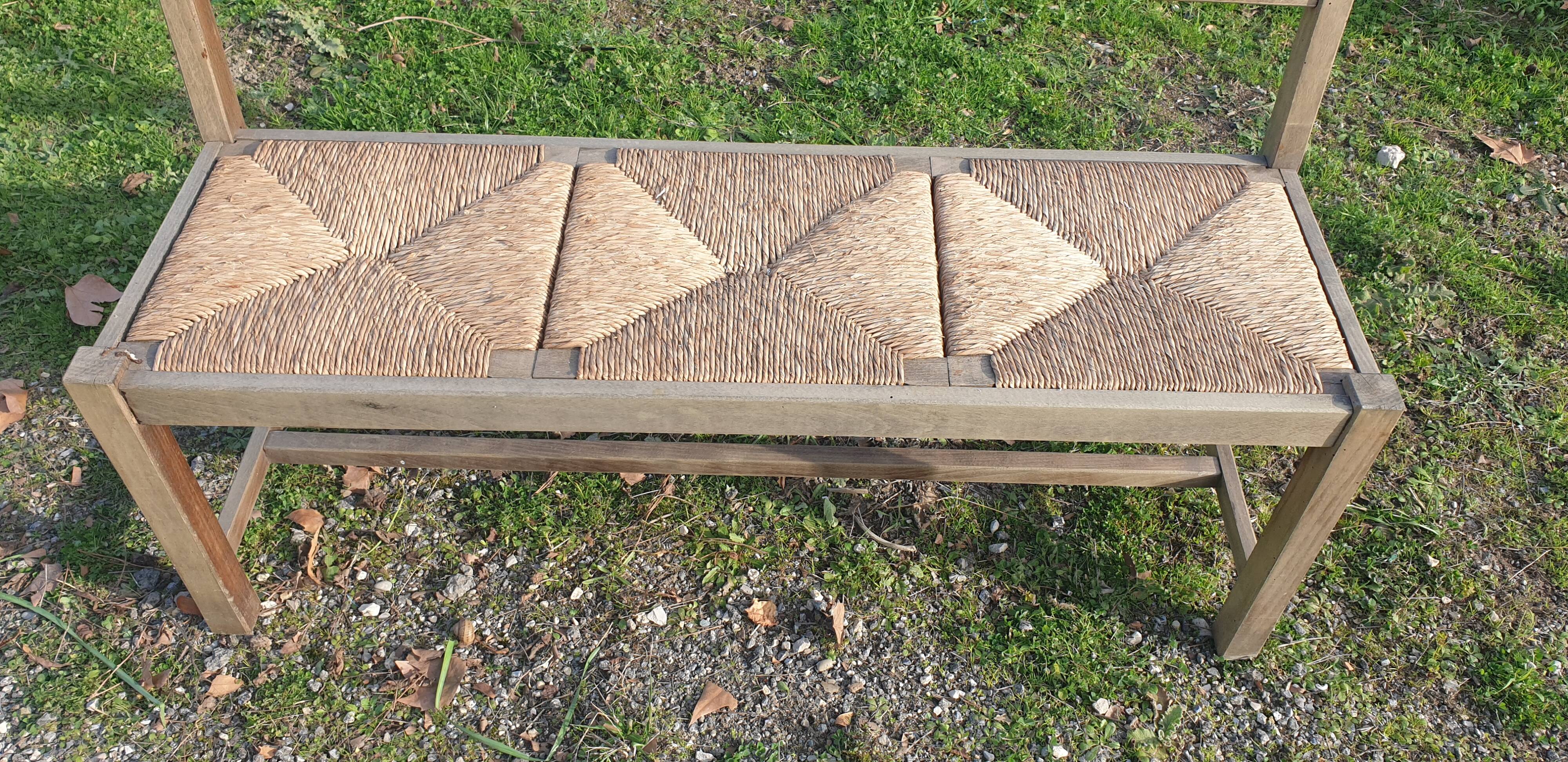Wooden bench with vintage straw seating