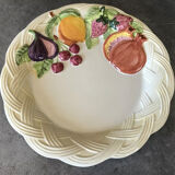 Vintage plate in ceramic enamelled decoration of fruits in relief