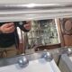 Aluminum wall coat rack with pivoting mirror from the 60s