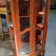 Vitrine d’époque Louis XV en bois de rose marqueté