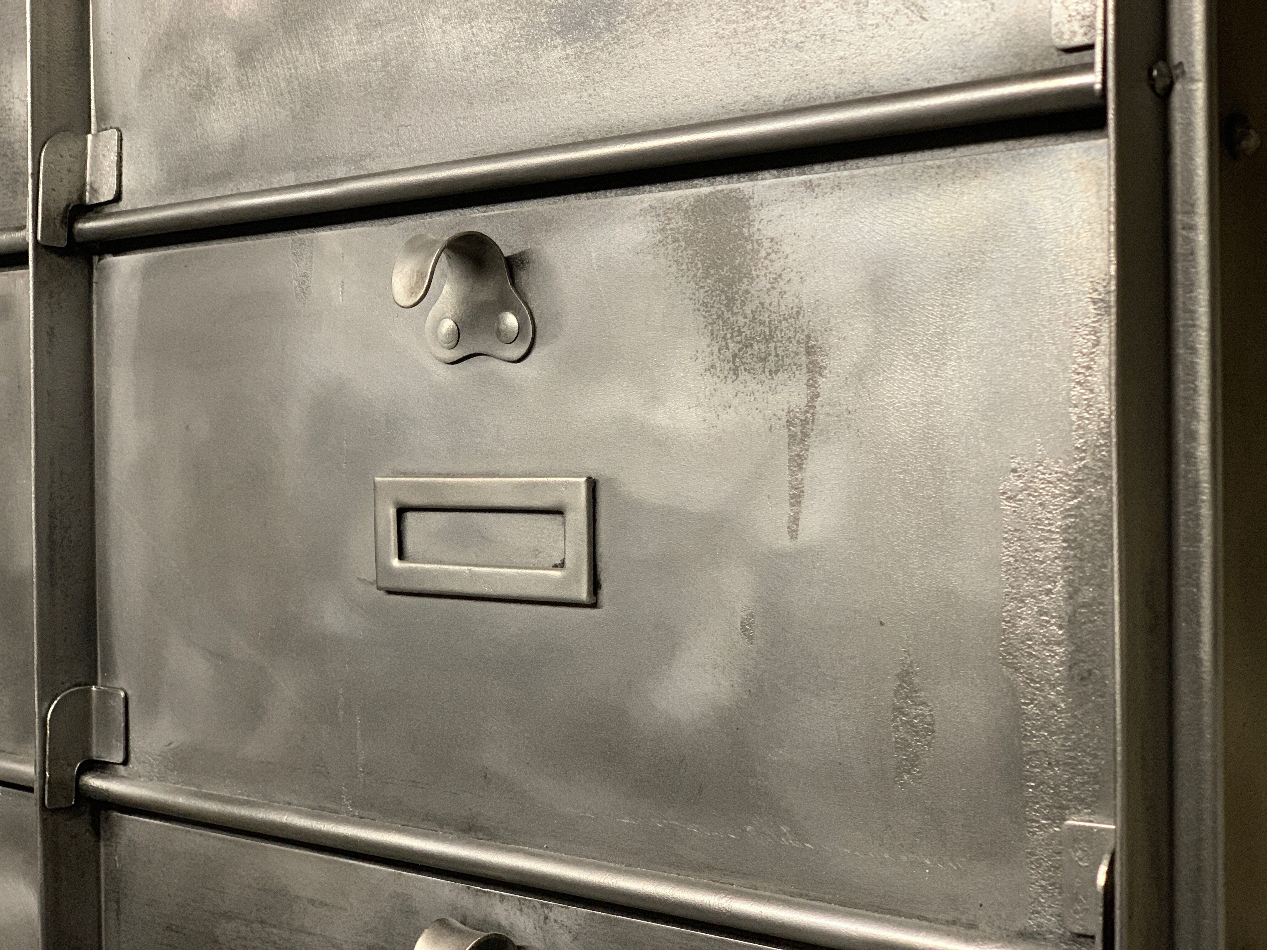 Industrial cladding furniture in brushed and patinated steel