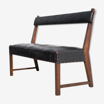 Antique wood bench and black imitation leather