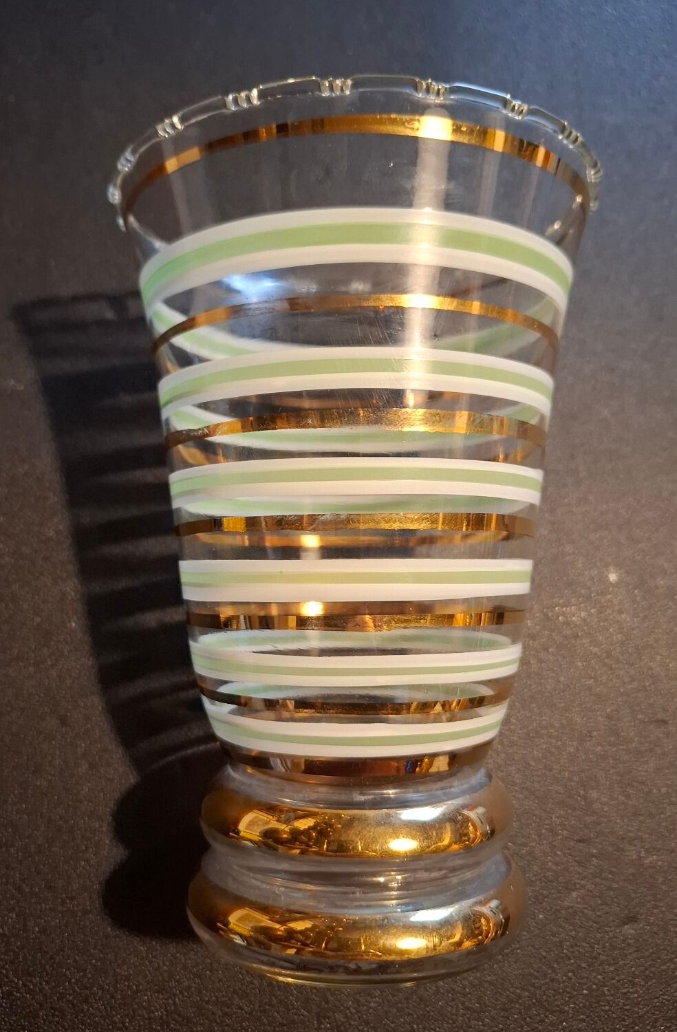 Vintage vase with green and gold trim.