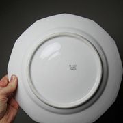 4 flat plates by Bernardaud, Limoges porcelain, floral decoration from the 1920s to 1950s.