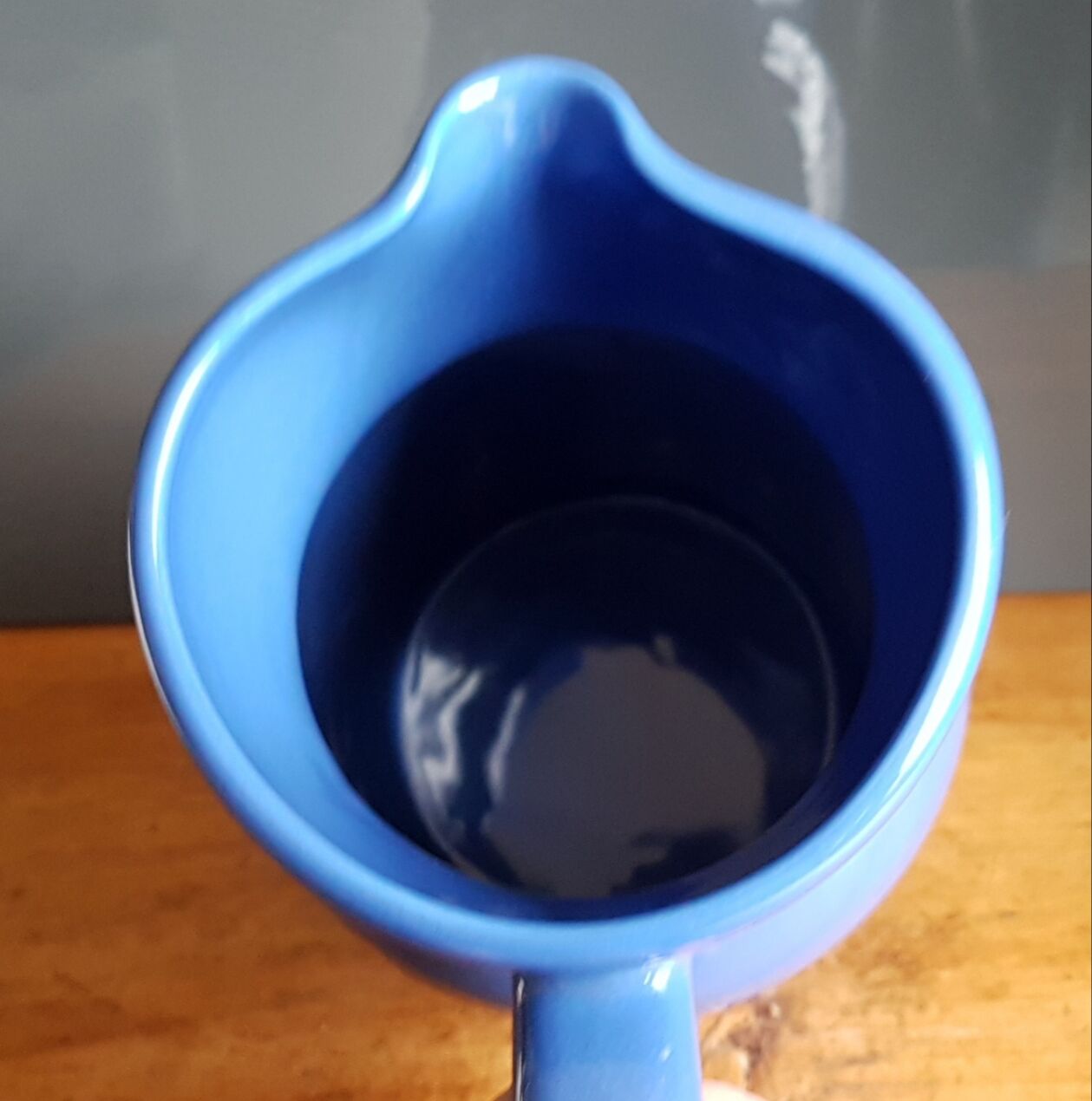 Blue ceramic pitcher