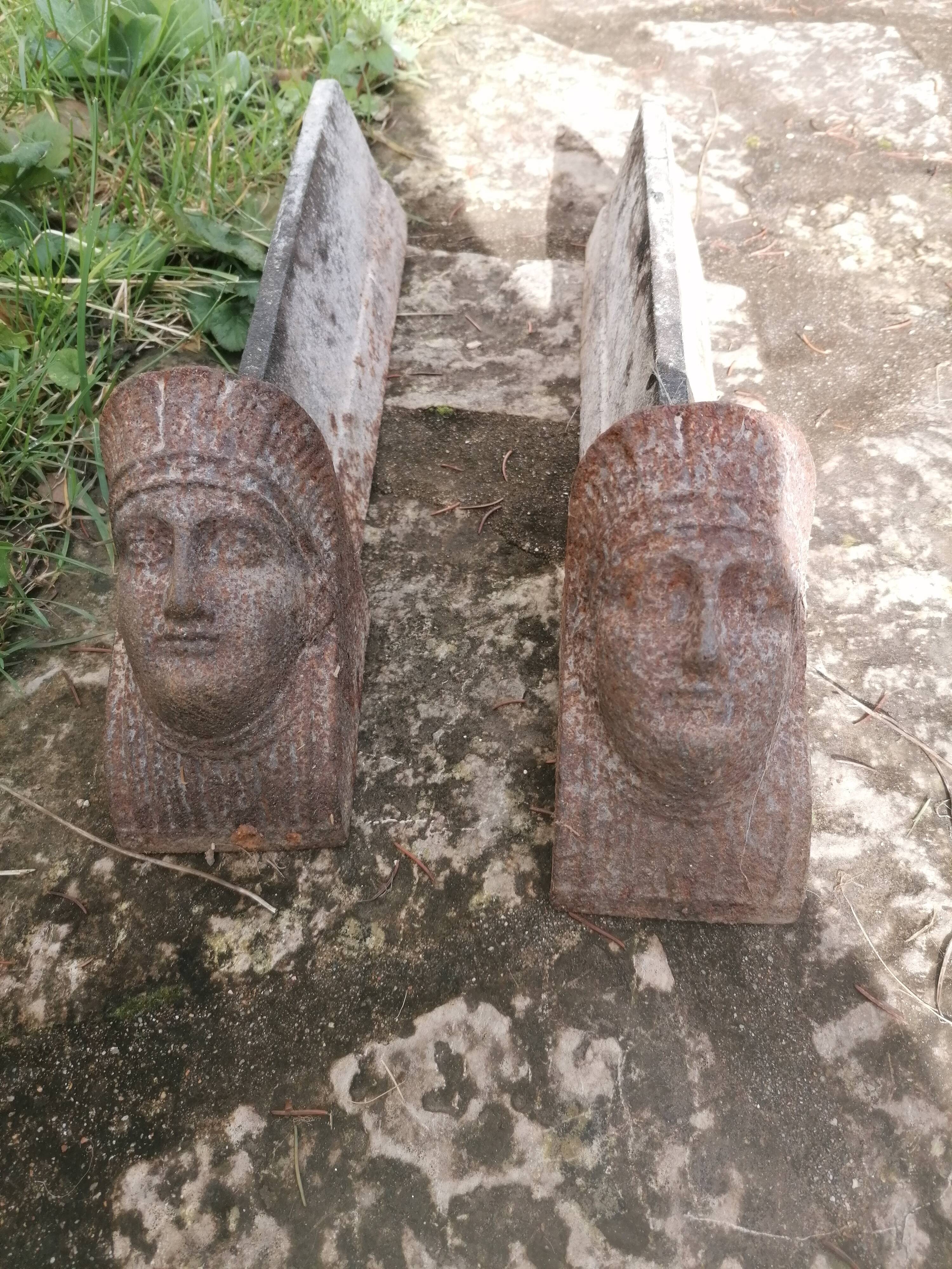 pair of andirons with sphinx heads