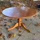 Round pine table with a diameter of 120 cm.