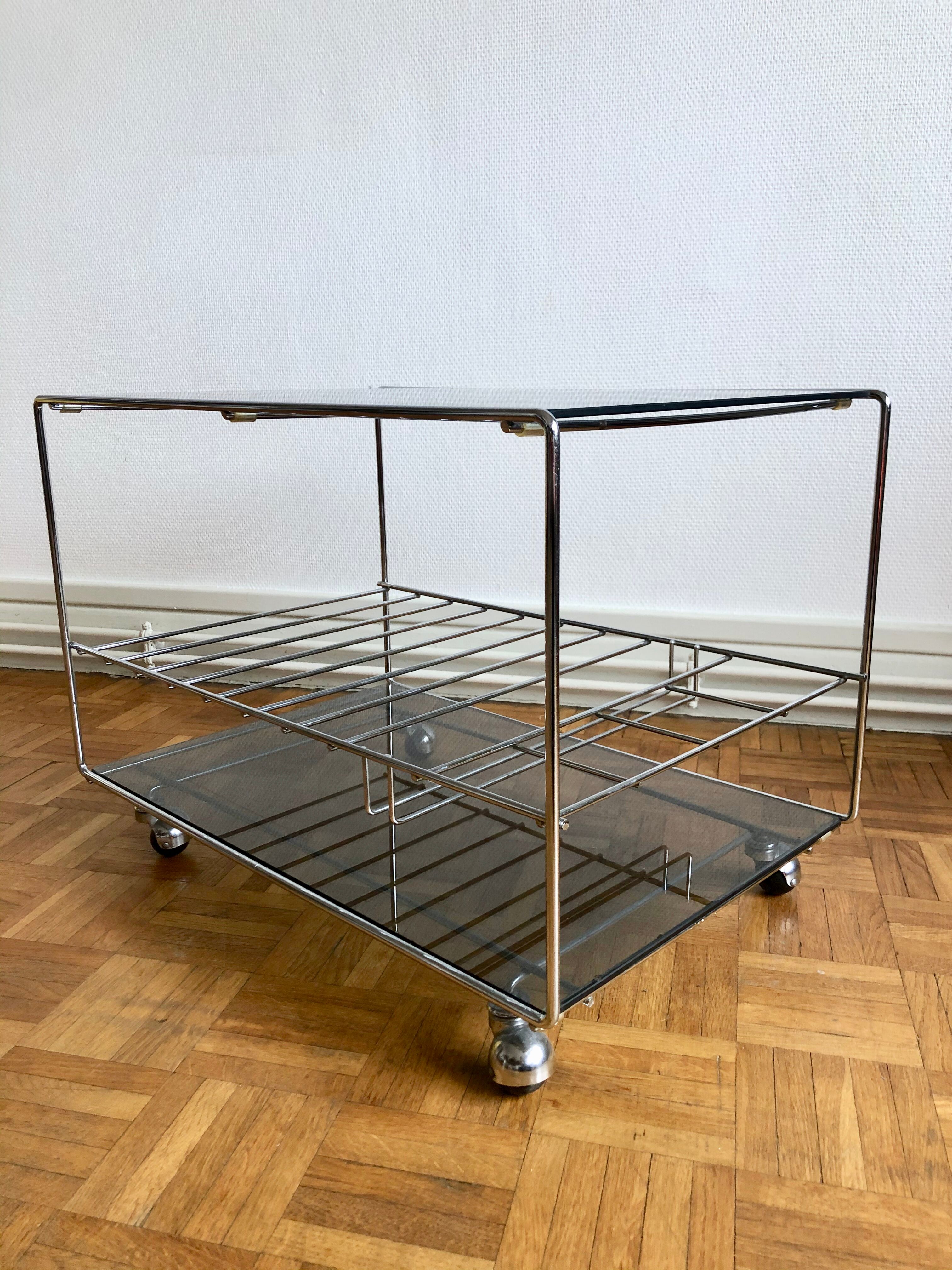 Glass and chrome wheeled vinyl holder