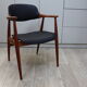 Vintage armchair in teak and black leather model Casina 60s