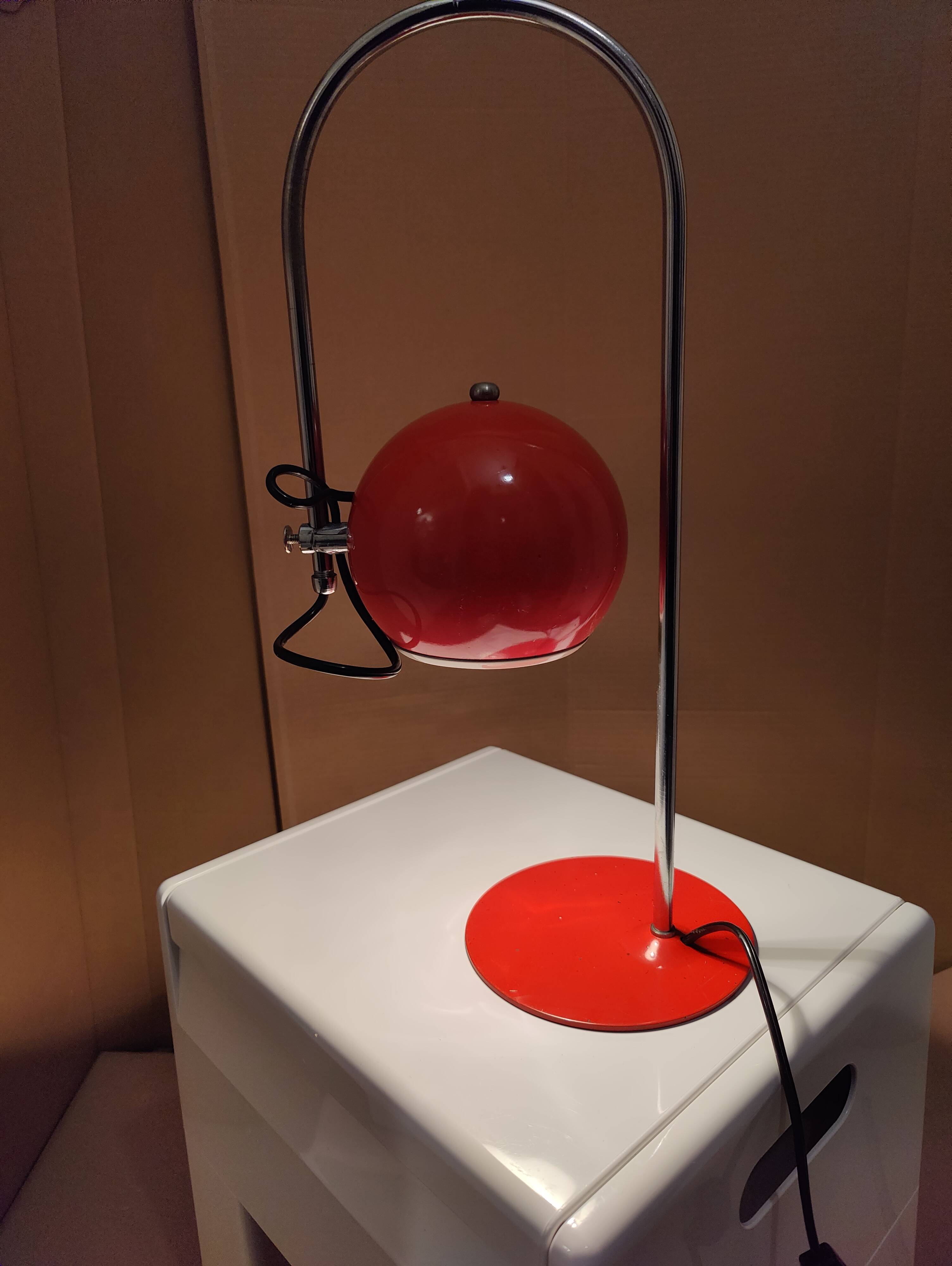 Eyeball space age orange desk or bedside lamp on an arc base