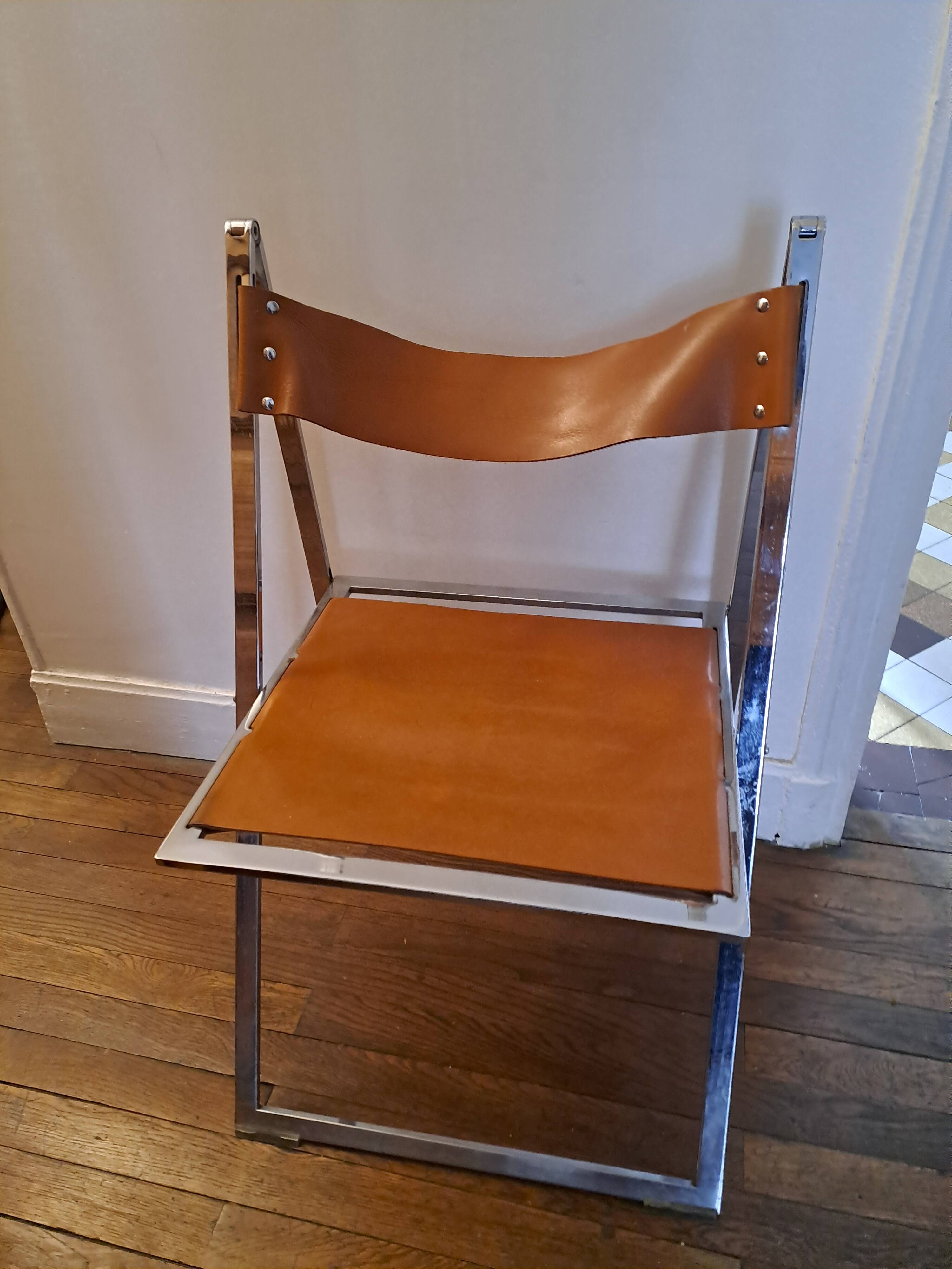 2 Chromed metal and leather folding chairs. 70s. Fontoni & Geraci