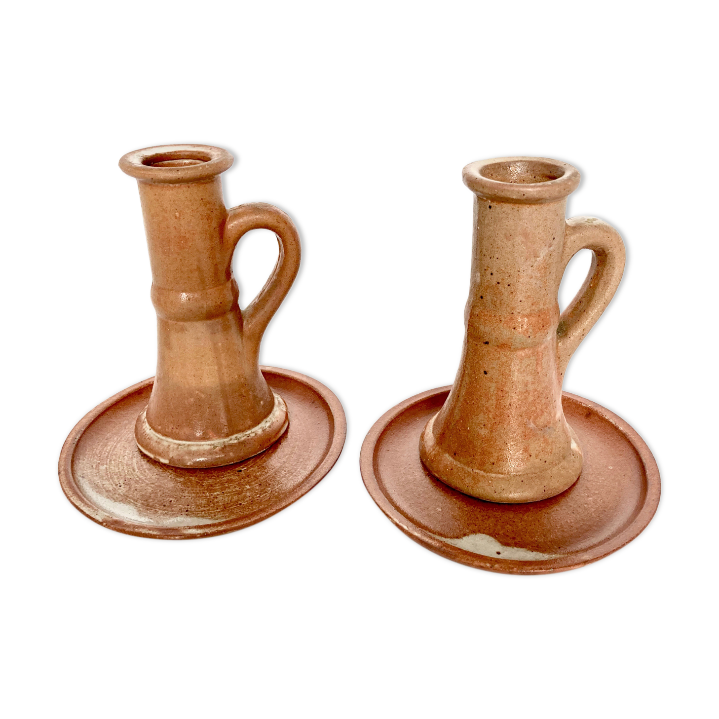 Pair of candlesticks and two sandstone cups