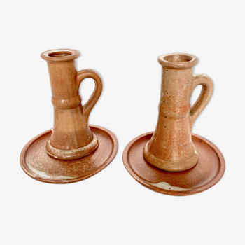 Pair of candlesticks and two sandstone cups