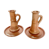 Pair of candlesticks and two sandstone cups