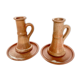 Pair of candlesticks and two sandstone cups
