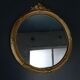 Miroir rond à fronton cadre bronze