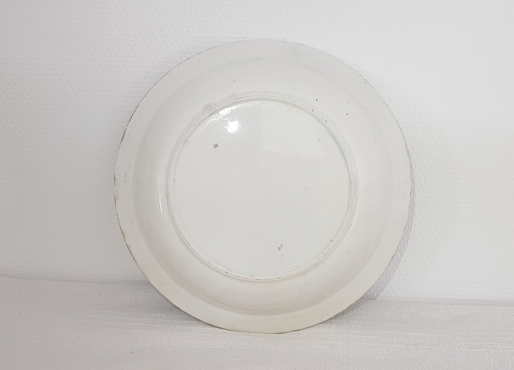 Hollow flat in earthenware of St Amand and Hamage model Primery, iron earth.