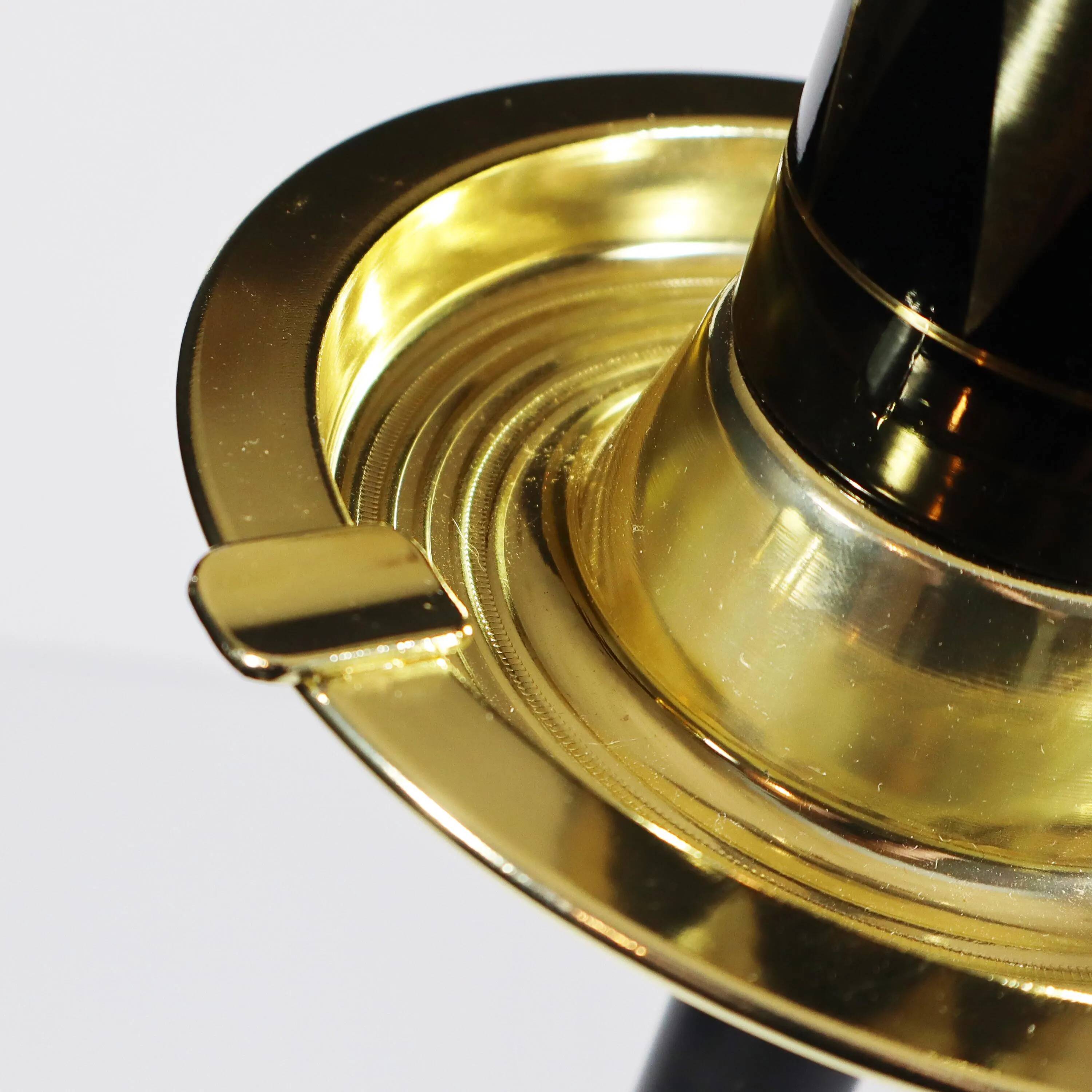 Vintage standing ashtray with cigarette dispenser in gold and black