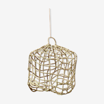 Suspension fishing net braided in palm leaf