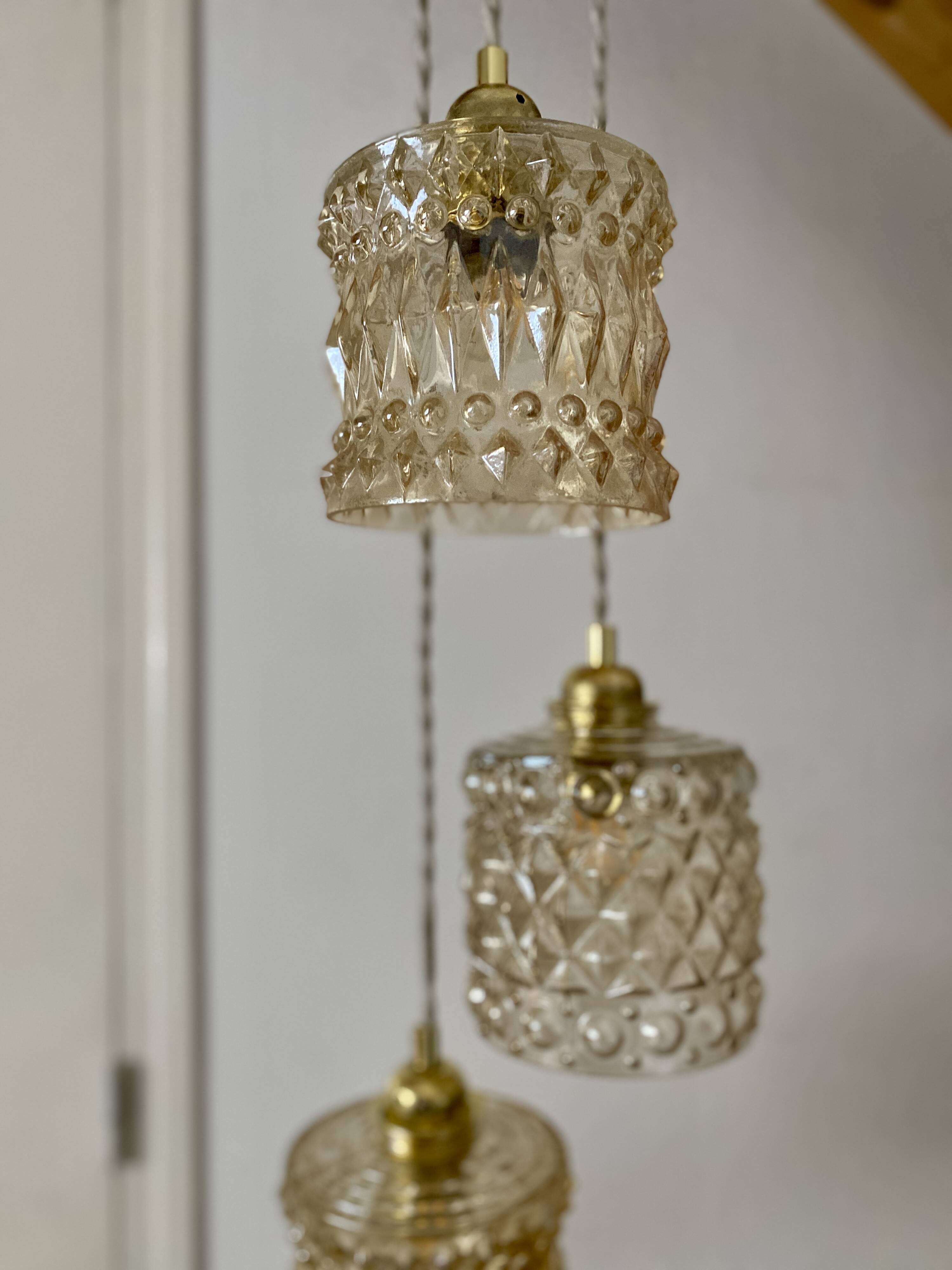 Triple antique globe pendant light in amber glass