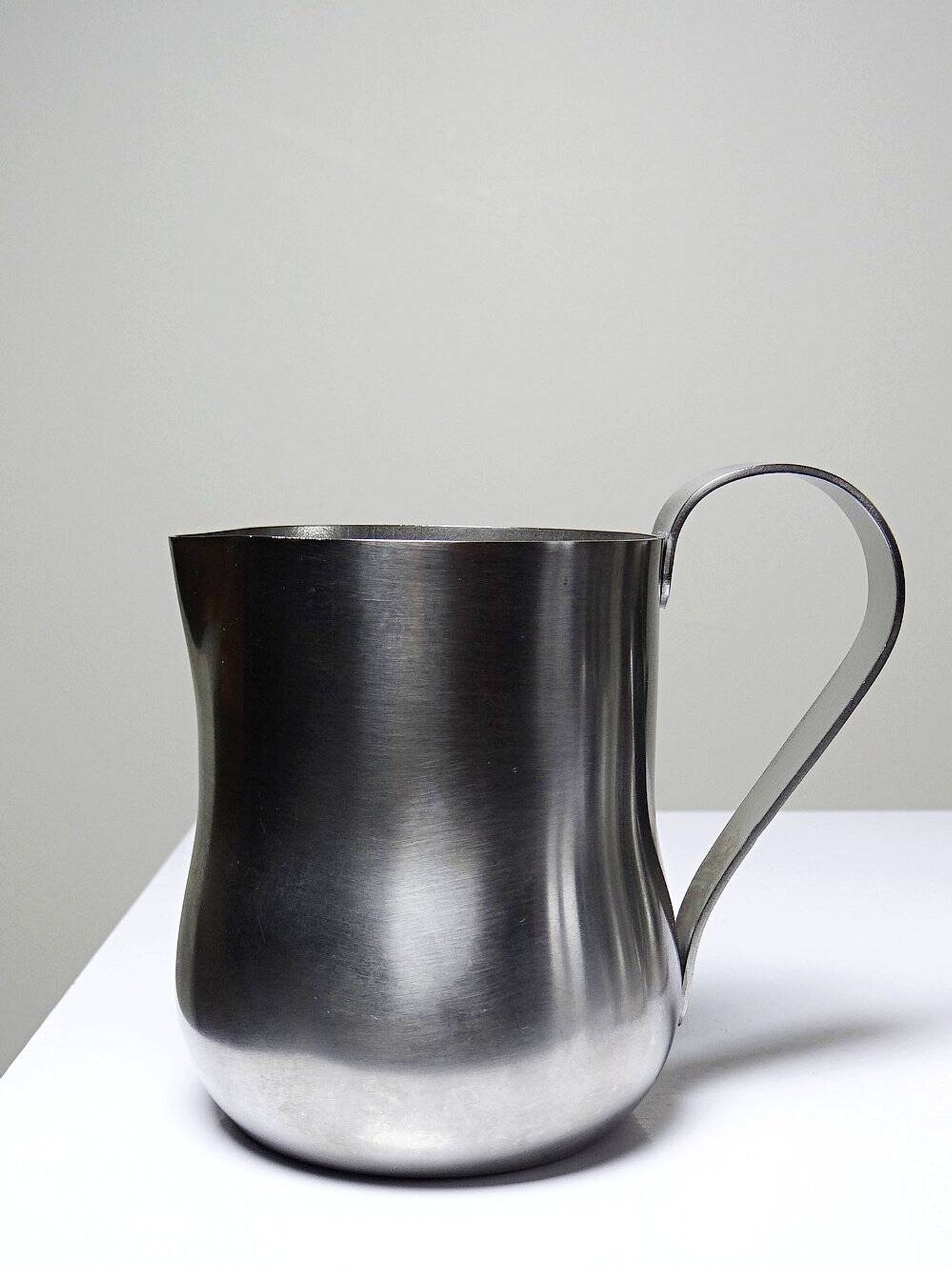 Set of 4 vintage bar measures in brushed stainless steel from the 60s-70s.