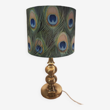 Brass lamp with a peacock feather lampshade