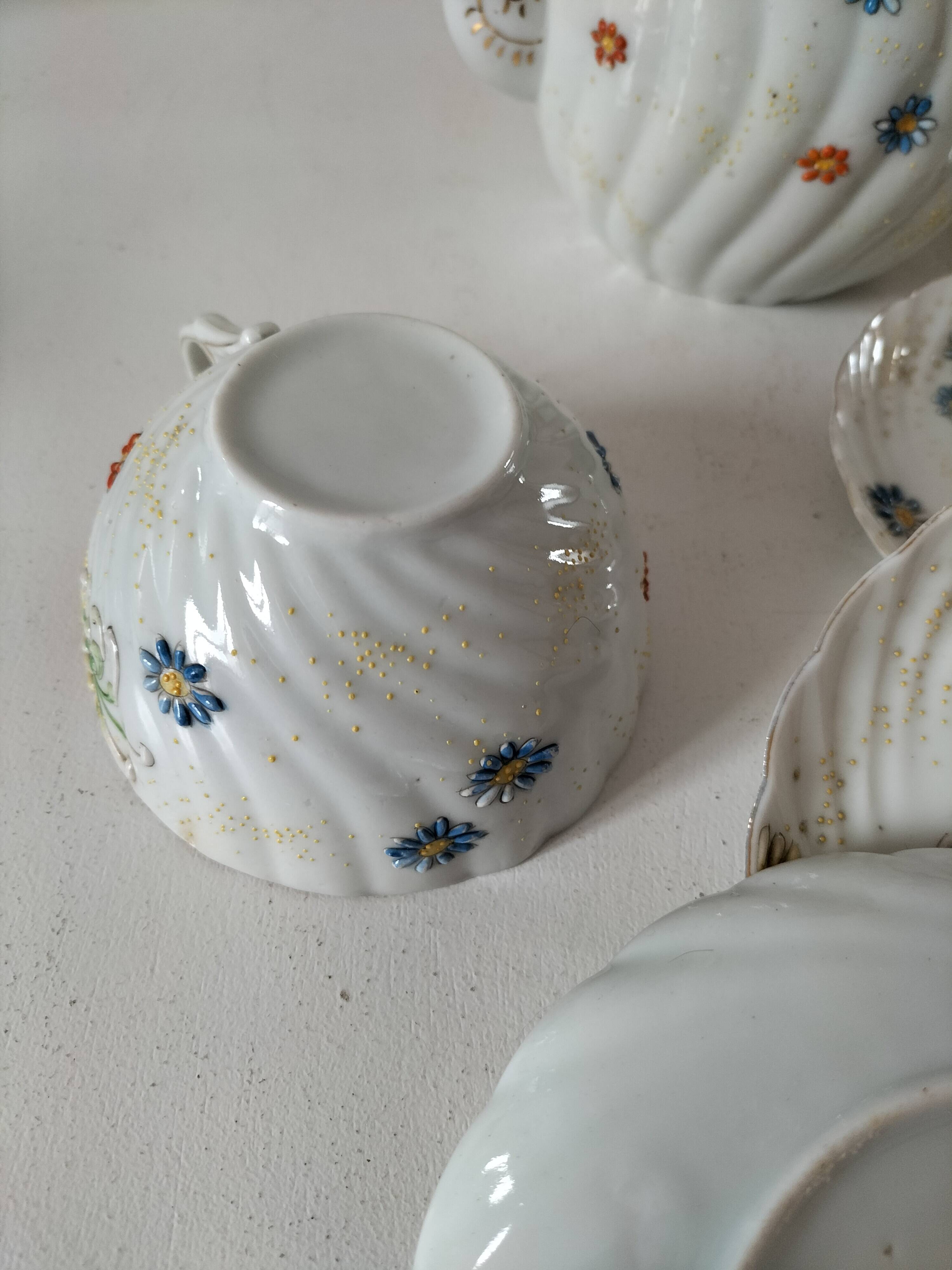 coffee pot, cup and saucers