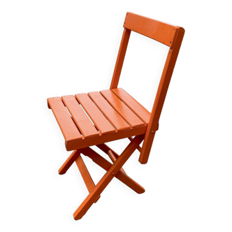 Chaise pliante vintage en bois peint orange
