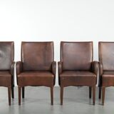 Set of 4 nicely finished dining chairs/side chairs with armrests made of cowhide leather