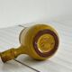 Yellow glazed ceramic sauce boat or milk jug