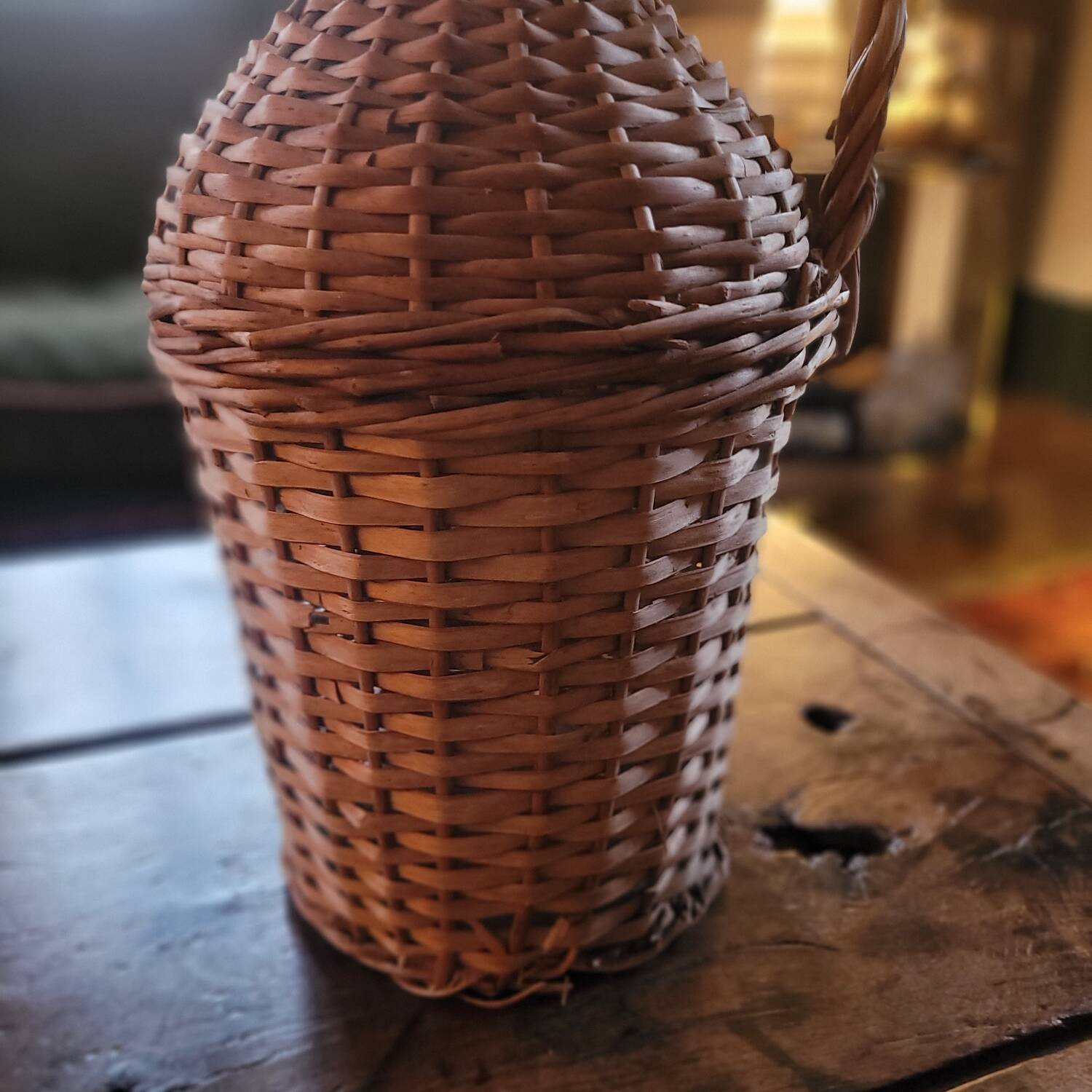 Glass demijohn encased in wicker, 1950s–1960s