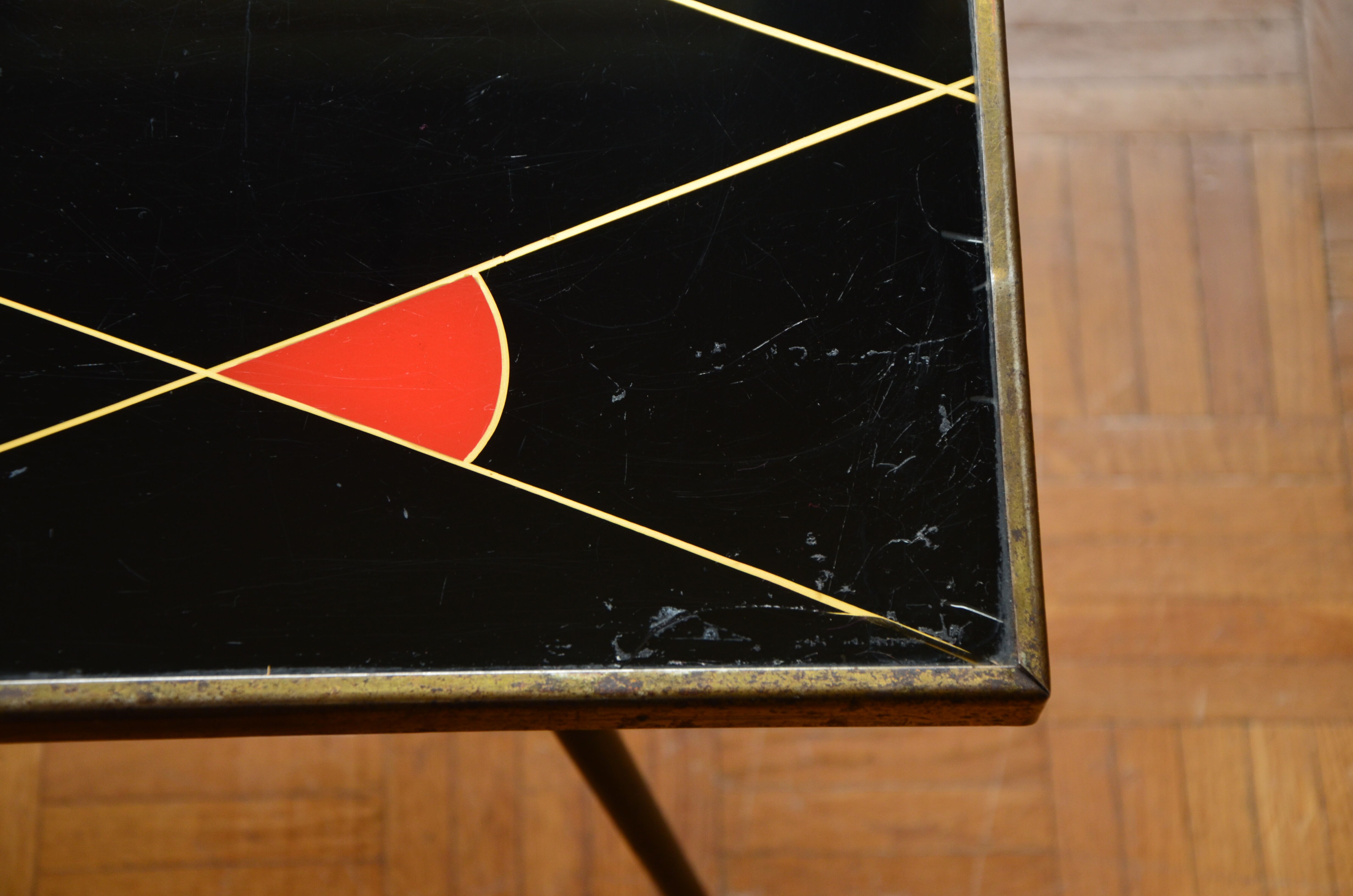Brass and glass coffee table with compass feet