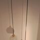Two-light pendant in a cascade of cut crystal globe