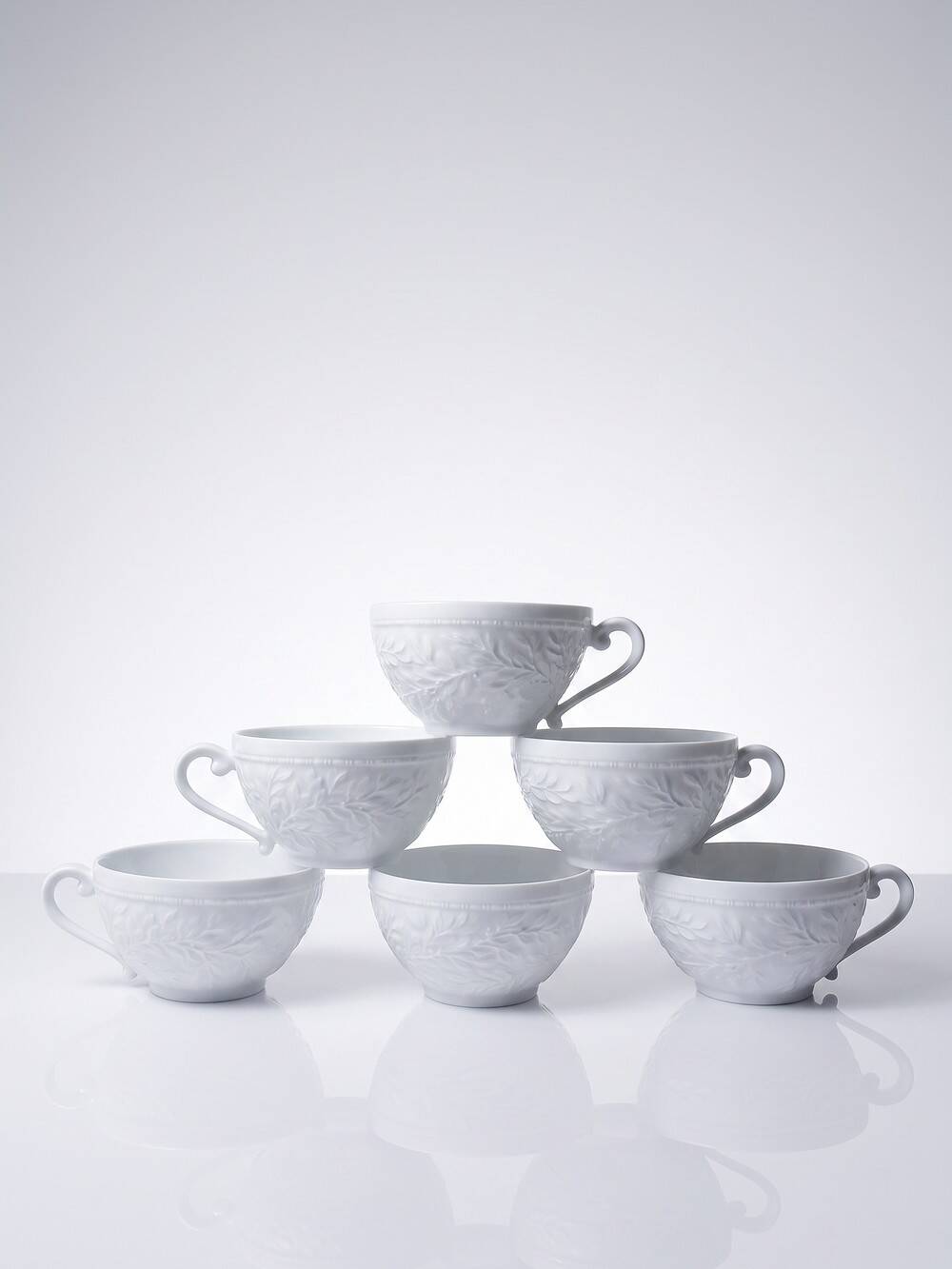 Set of 6 Bernardaud Limoges Louvre model white porcelain cups.