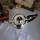 Old English coffee pot in silver-plated metal and Bakelite.