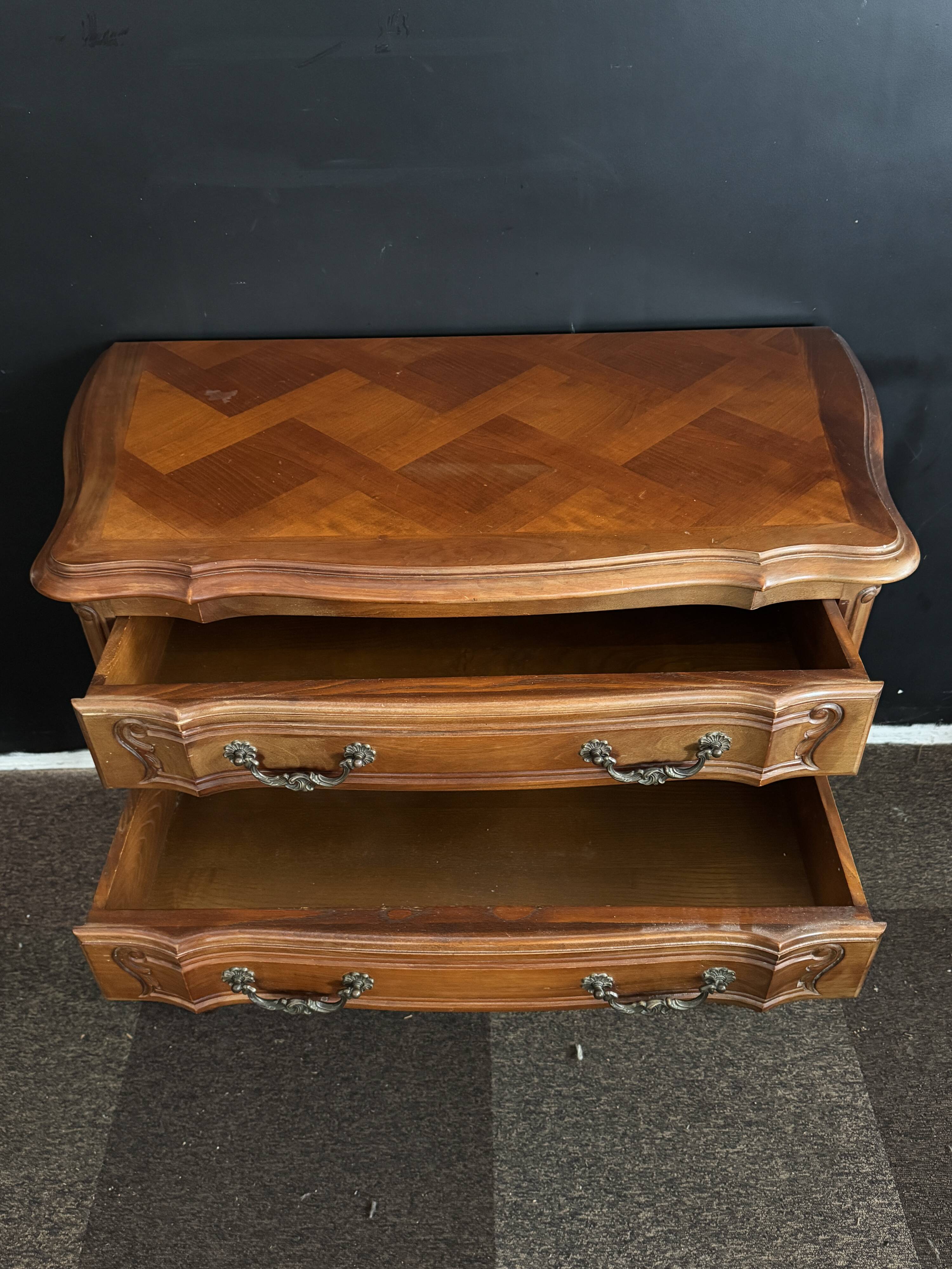 Carved wooden chest of drawers